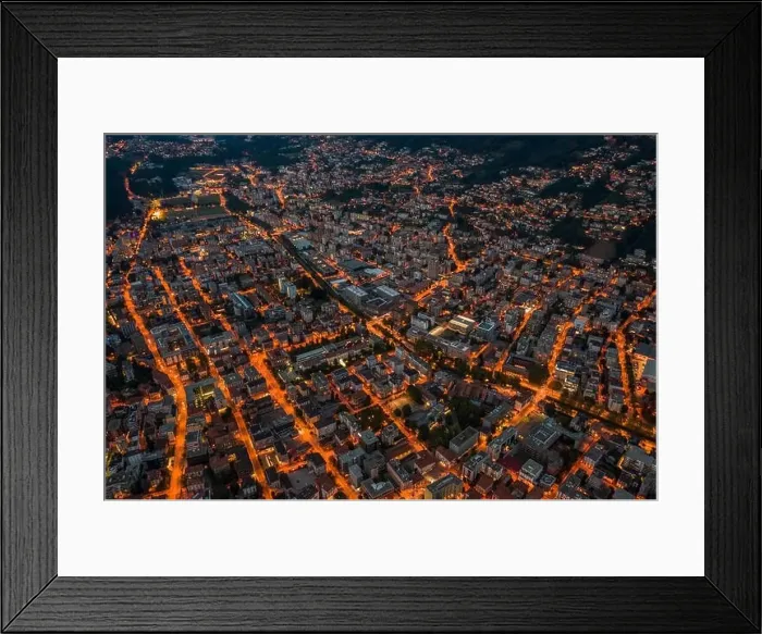 Framed Print : High angle aerial drone night shot of city street lights in Lugano, Switzerland Framed Print : High angle aerial drone night shot of city street lights in Lugano, Switzerland