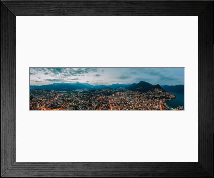 Framed Print : Panorama aerial drone night shot of city street lights by lake in Lugano, Switzerland Framed Print : Panorama aerial drone night shot of city street lights by lake in Lugano, Switzerland