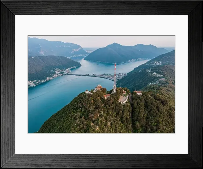 Framed Print : Aerial drone shot view of top of monte salvatore, san giorgio, and bridge diga di melide in swiss italian border Framed Print : Aerial drone shot view of top of monte salvatore, san giorgio, and bridge diga di melide in swiss italian border