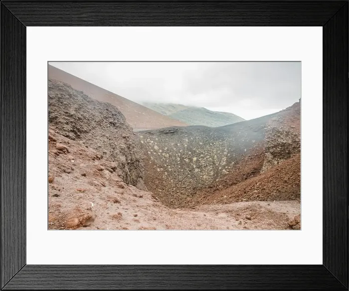 Framed Print : Top of crater Mount Etna volcano, frozen cold lava smokes, thick clouds Framed Print : Top of crater Mount Etna volcano, frozen cold lava smokes, thick clouds
