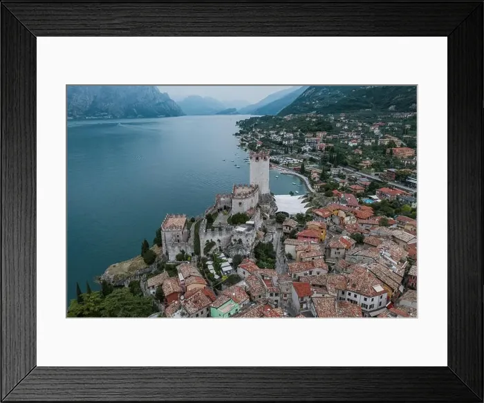 Framed Print : High angle aerial drone shot view of Malcesine Coastline by lake garda in Italy Framed Print : High angle aerial drone shot view of Malcesine Coastline by lake garda in Italy
