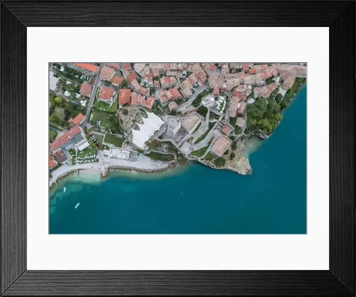 Framed Print : Overhead aerial drone shot view of village Malcesine coastline by lake garda Framed Print : Overhead aerial drone shot view of village Malcesine coastline by lake garda