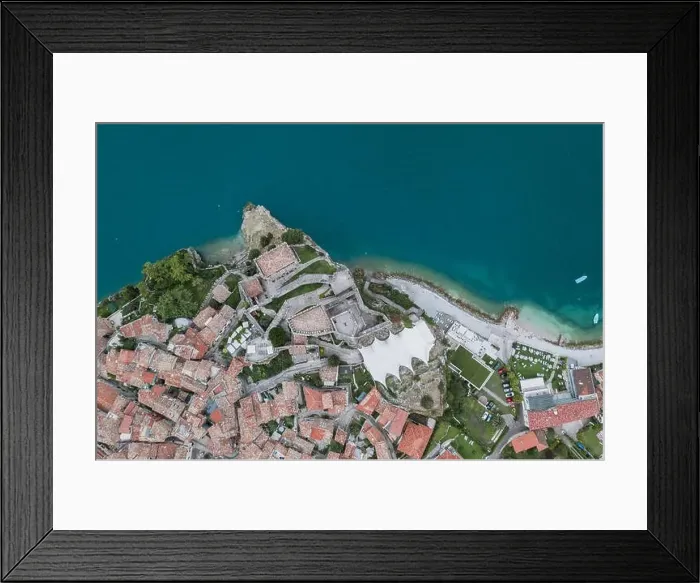 Framed Print : Overhead aerial drone shot view of village Malcesine coastline by lake garda Framed Print : Overhead aerial drone shot view of village Malcesine coastline by lake garda