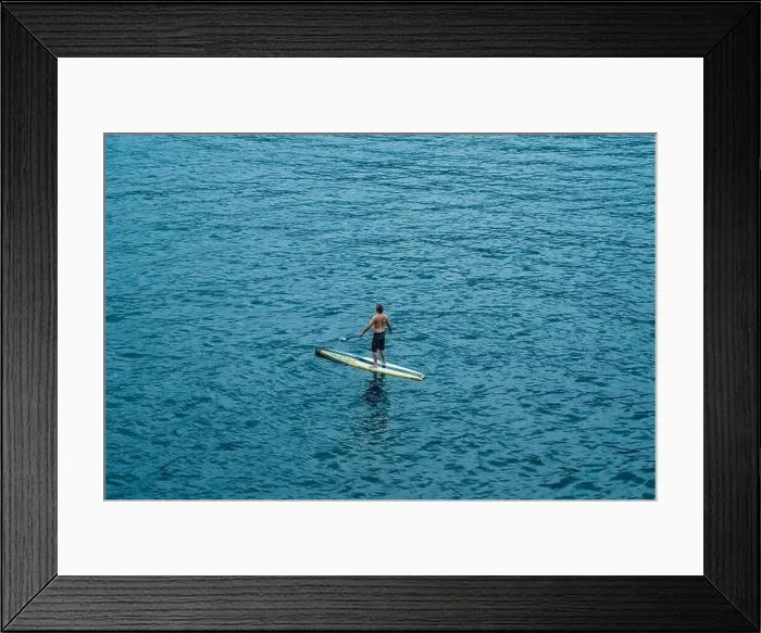 Framed Print : Malcesine, Italy - August 7, 2019: A man on surboard in Lake Garda Framed Print : Malcesine, Italy - August 7, 2019: A man on surboard in Lake Garda