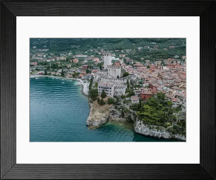 Framed Print : High angle aerial drone shot view of Castello Malcesine village in Italy Framed Print : High angle aerial drone shot view of Castello Malcesine village in Italy
