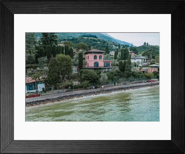 Framed Print : Malcesine, Italy - August 7, 2019: Tourists walk on lakeside of Lake Garda Framed Print : Malcesine, Italy - August 7, 2019: Tourists walk on lakeside of Lake Garda
