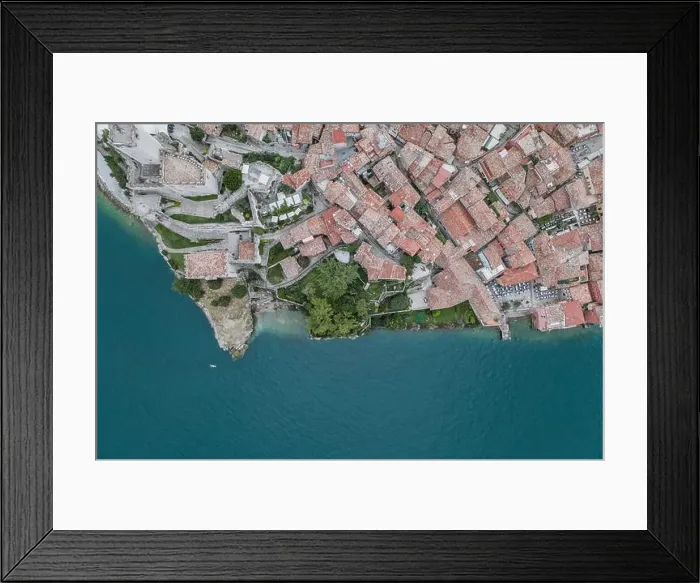 Framed Print : Overhead aerial drone shot view of village Malcesine coastline by lake garda Framed Print : Overhead aerial drone shot view of village Malcesine coastline by lake garda