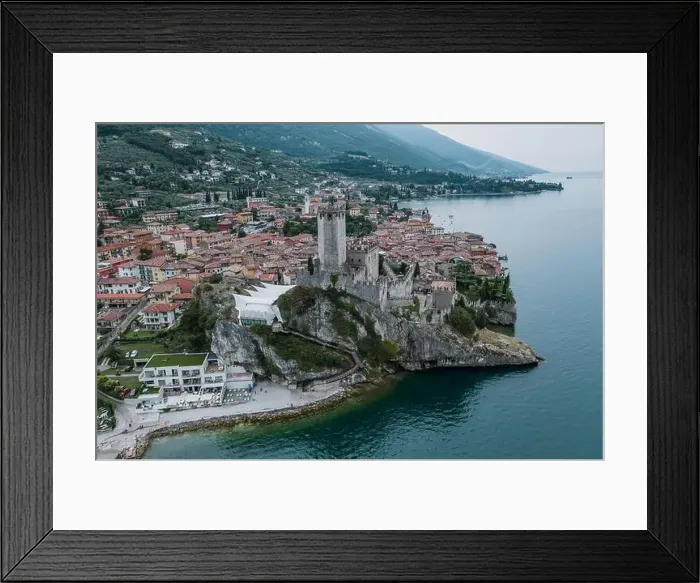 Framed Print : High angle aerial drone shot view of Castello Malcesine village in Italy Framed Print : High angle aerial drone shot view of Castello Malcesine village in Italy