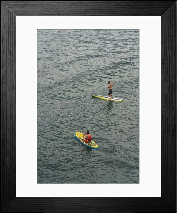 Framed Print : Malcesine, Italy - August 7, 2019: A man on surboard in Lake Garda Framed Print : Malcesine, Italy - August 7, 2019: A man on surboard in Lake Garda