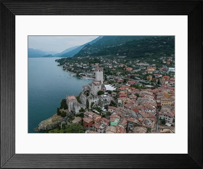 Framed Print : High angle aerial drone shot view of Malcesine Coastline by lake garda in Italy Framed Print : High angle aerial drone shot view of Malcesine Coastline by lake garda in Italy