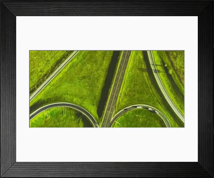 Framed Print : Drone view of morning empty country side road with beautiful green landscape around Framed Print : Drone view of morning empty country side road with beautiful green landscape around