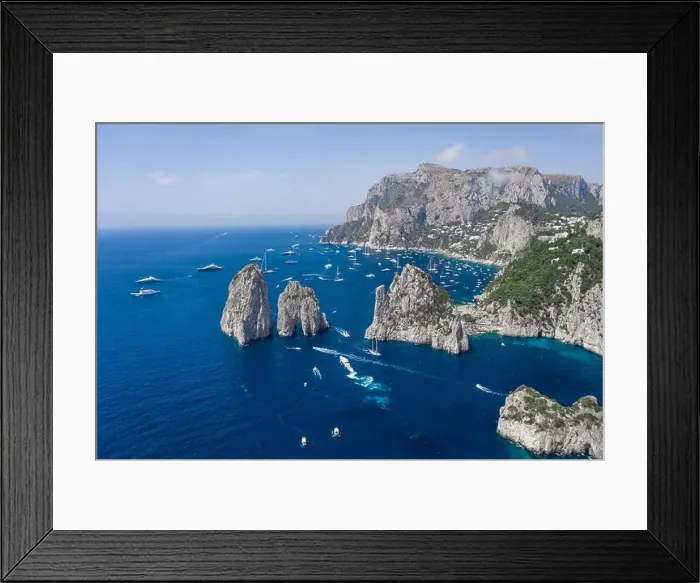 Framed Print : Aerial drone shot view of Faraglioni from east Capri Island in Tyrrhenian sea with Luxury yachts Framed Print : Aerial drone shot view of Faraglioni from east Capri Island in Tyrrhenian sea with Luxury yachts