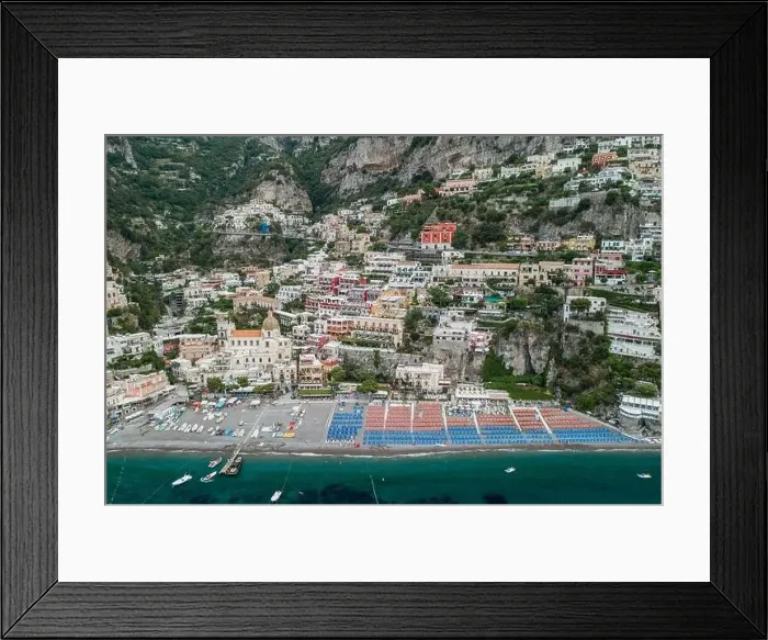 Framed Print : Aerial drone shot view of Positano village and beach with parasols in the morning in Amalfi Coast, Salerno Framed Print : Aerial drone shot view of Positano village and beach with parasols in the morning in Amalfi Coast, Salerno