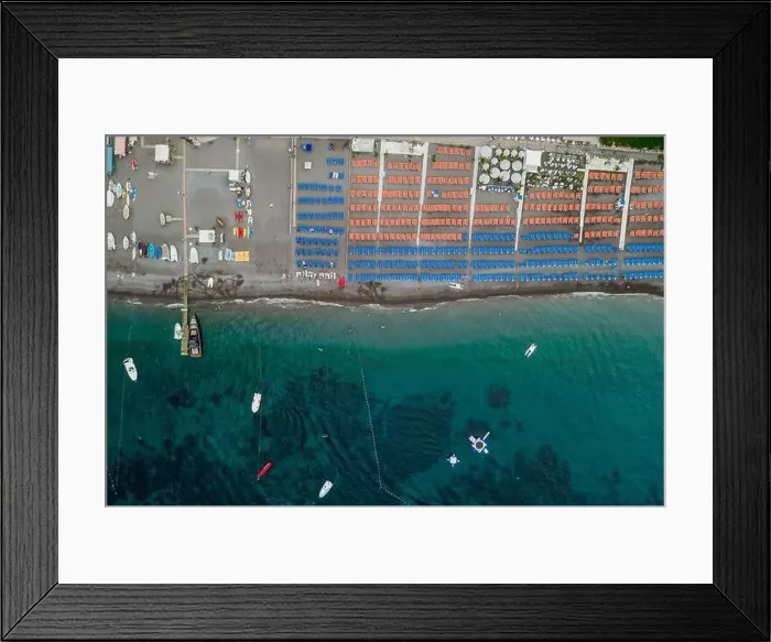 Framed Print : Aerial overhead drone shot view of Positano beach with beach umbrella in morning time Framed Print : Aerial overhead drone shot view of Positano beach with beach umbrella in morning time