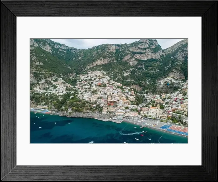 Framed Print : Aerial drone shot view of Positano village and beach in the morning in Amalfi Coast, Salerno Framed Print : Aerial drone shot view of Positano village and beach in the morning in Amalfi Coast, Salerno
