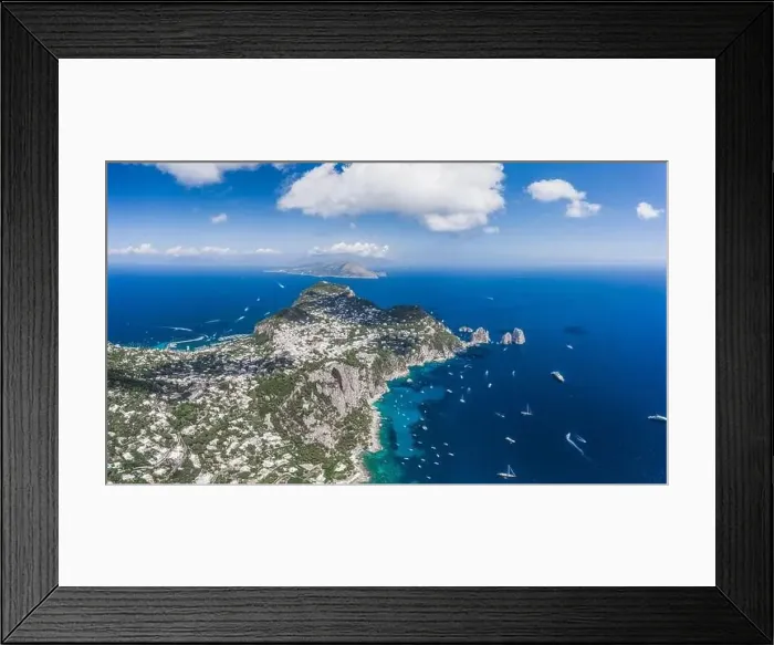 Framed Print : Aerial panoramic drone view of south Capri Island crag coastline with faraglioni in summer time Framed Print : Aerial panoramic drone view of south Capri Island crag coastline with faraglioni in summer time