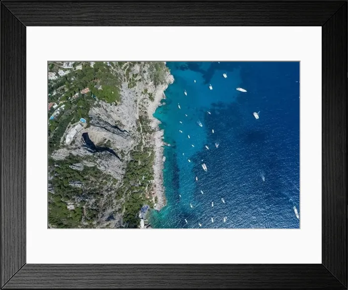 Framed Print : Aerial overhead drone shot of southern Capri Island coastline with mountain top pool and big hole underneath Framed Print : Aerial overhead drone shot of southern Capri Island coastline with mountain top pool and big hole underneath