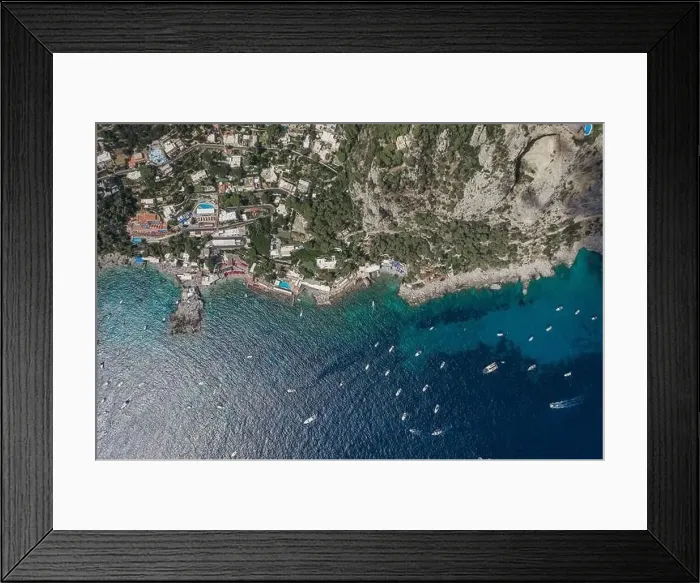 Framed Print : Aerial overhead drone shot of southern Capri Island coastline with yachts in summer noon