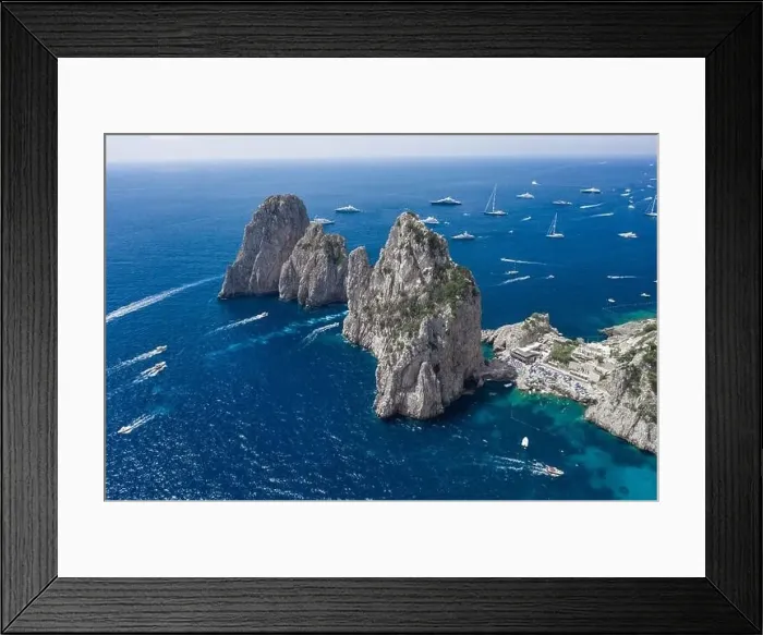 Framed Print : Aerial drone shot view of Faraglioni from east Capri Island in Tyrrhenian sea with Luxury yachts Framed Print : Aerial drone shot view of Faraglioni from east Capri Island in Tyrrhenian sea with Luxury yachts
