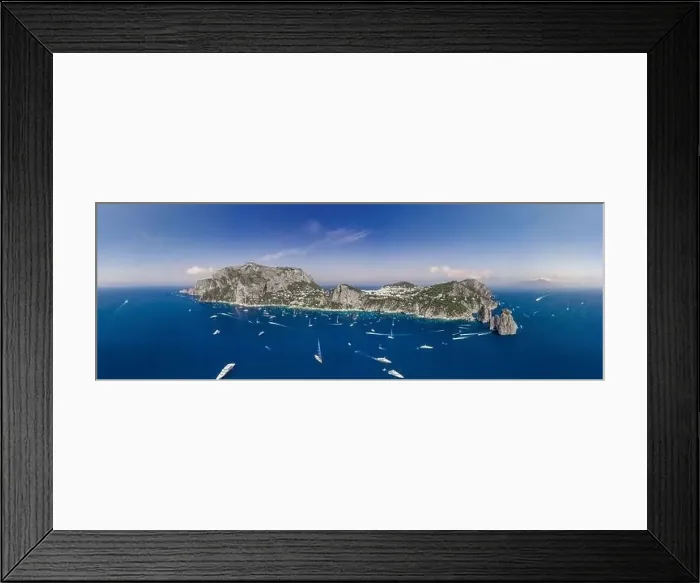 Framed Print : Panoramic view of south Capri Island coastline and faraglioni limestone crags in Tyrrhenian sea Framed Print : Panoramic view of south Capri Island coastline and faraglioni limestone crags in Tyrrhenian sea