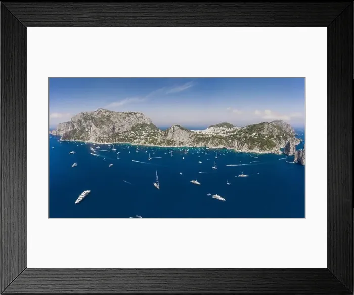 Framed Print : Panoramic view of south Capri Island coastline and faraglioni limestone crags in Tyrrhenian sea Framed Print : Panoramic view of south Capri Island coastline and faraglioni limestone crags in Tyrrhenian sea