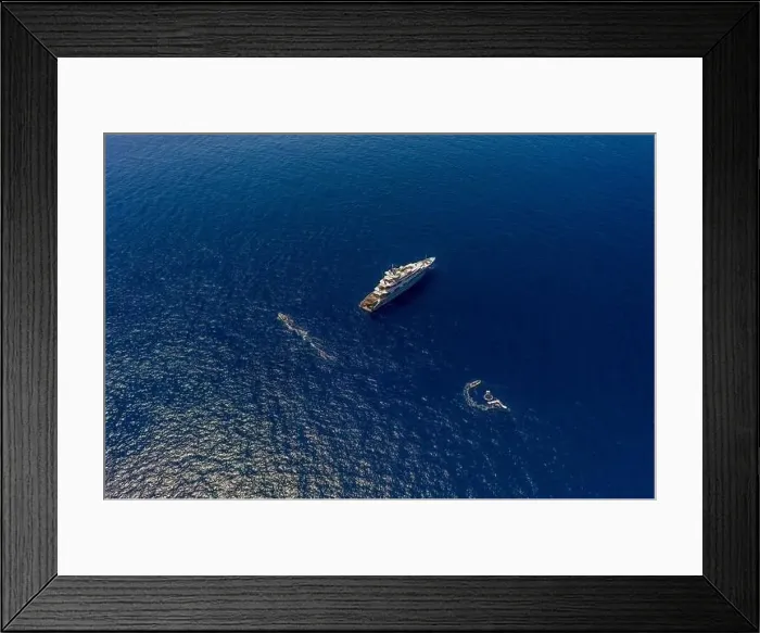 Framed Print : Aerial high-angle drone shot of luxury yacht in Tyrrhenian sea near Capri Island in summer Framed Print : Aerial high-angle drone shot of luxury yacht in Tyrrhenian sea near Capri Island in summer