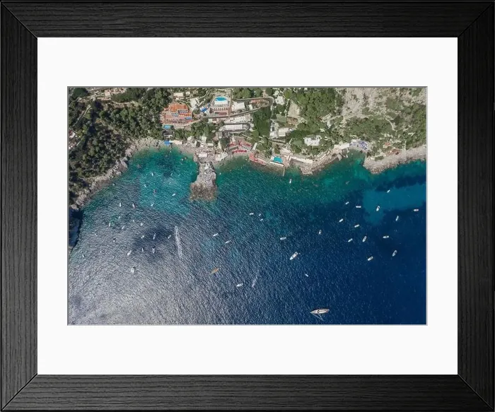 Framed Print : Aerial overhead drone shot of southern Capri Island coastline with yachts in summer noon Framed Print : Aerial overhead drone shot of southern Capri Island coastline with yachts in summer noon