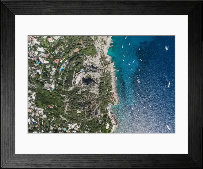 Framed Print : Aerial overhead drone shot of mountain top villa with pool above big mountain hole cave in south Capri Island Framed Print : Aerial overhead drone shot of mountain top villa with pool above big mountain hole cave in south Capri Island