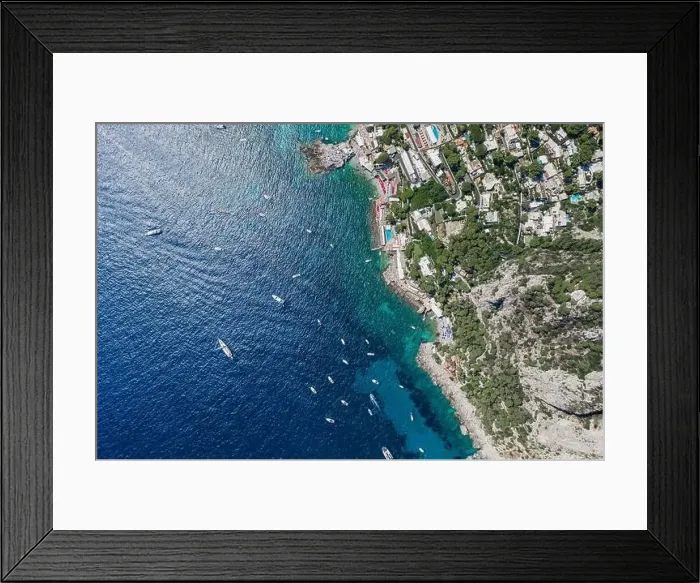 Framed Print : Aerial overhead drone shot of southern Capri Island coastline with yachts in summer noon Framed Print : Aerial overhead drone shot of southern Capri Island coastline with yachts in summer noon