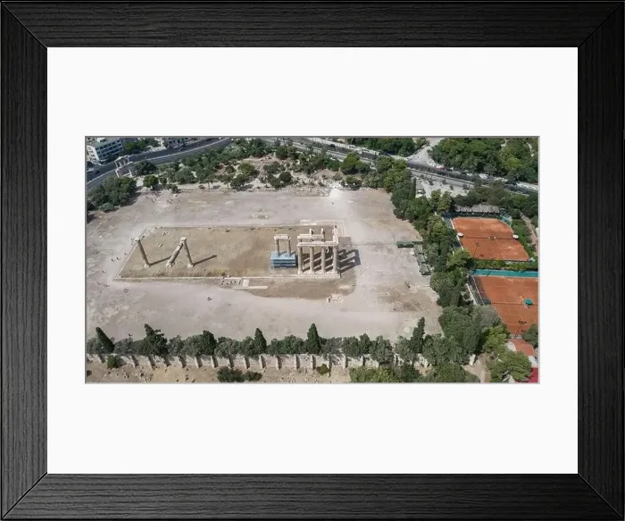Framed Print : Aerial drone shot of temple ruins at Archaeological Site of Olympieion with tennis court biesdes Framed Print : Aerial drone shot of temple ruins at Archaeological Site of Olympieion with tennis court biesdes