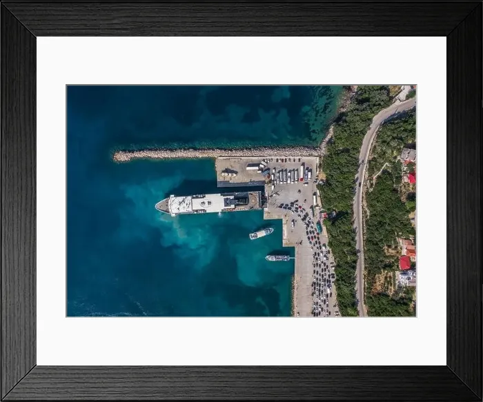Framed Print : Aerial overhead drone shot of cars embarking on big cruise ship at Poros town harbour of Kefalonia Island