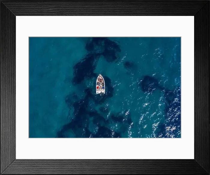 Framed Print : Aerial drone shot view of a boat in Ionian sea near Zakynthos Island Framed Print : Aerial drone shot view of a boat in Ionian sea near Zakynthos Island