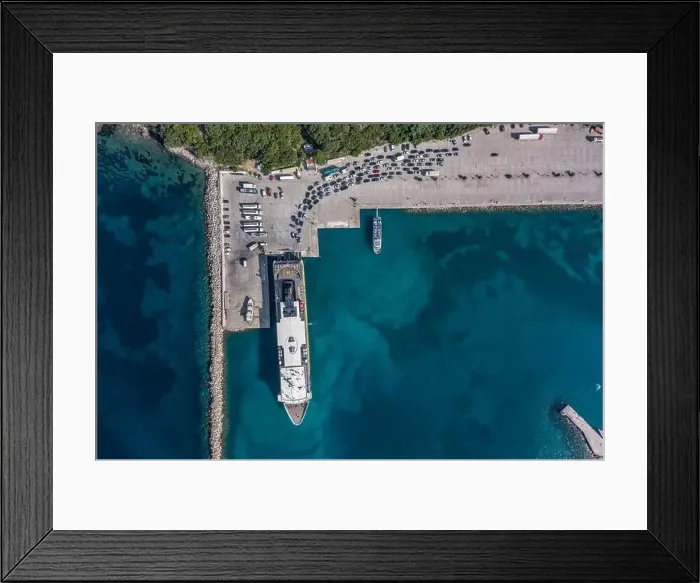 Framed Print : Aerial overhead drone shot of cars embarking on big cruise ship at Poros town harbour of Kefalonia Island Framed Print : Aerial overhead drone shot of cars embarking on big cruise ship at Poros town harbour of Kefalonia Island