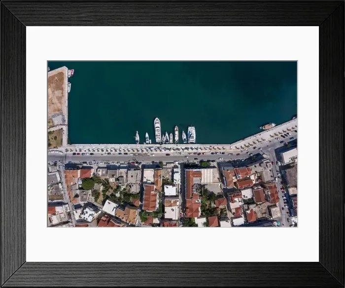 Framed Print : Overhead aerial drone shot of Argostolion bund street in summer afternoon in Kefalonia island Framed Print : Overhead aerial drone shot of Argostolion bund street in summer afternoon in Kefalonia island