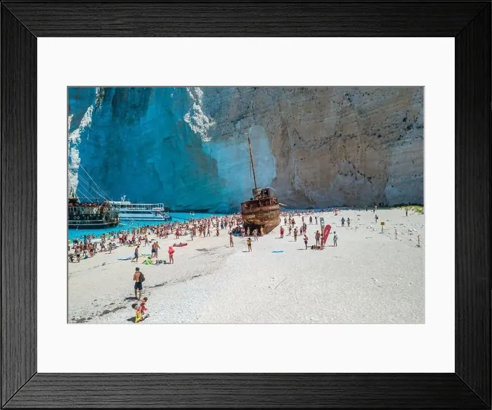 Framed Print : Zakynthos, Greece - August 20, 2019: Aerial drone shot of tourists on Zakynthos Shipwreck Navagio beach Framed Print : Zakynthos, Greece - August 20, 2019: Aerial drone shot of tourists on Zakynthos Shipwreck Navagio beach