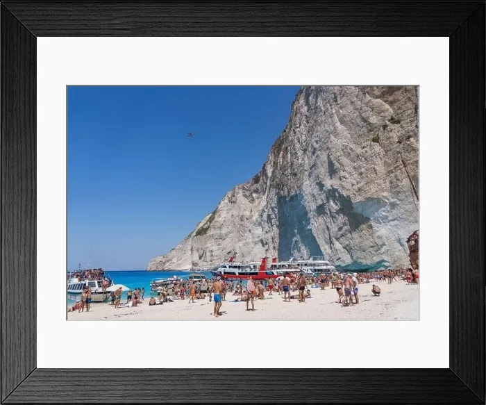 Framed Print : Zakynthos, Greece - August 20, 2019: drone take aerial photos of tourists on shopwreck Navagio beach in summer