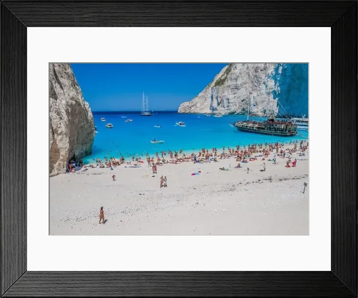 Framed Print : Zakynthos, Greece - August 20, 2019: Aerial drone shot of tourists on Zakynthos Shipwreck Navagio beach Framed Print : Zakynthos, Greece - August 20, 2019: Aerial drone shot of tourists on Zakynthos Shipwreck Navagio beach