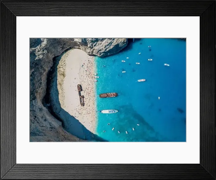 Framed Print : Aerial overhead drone shot of Zakynthos Navagio beach with tourists, cruise ship and yachts Framed Print : Aerial overhead drone shot of Zakynthos Navagio beach with tourists, cruise ship and yachts