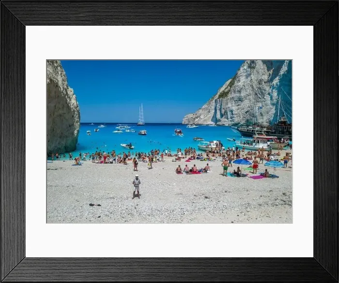 Framed Print : Zakynthos, Greece - August 20, 2019: Aerial drone shot of tourists on Zakynthos Shipwreck Navagio beach Framed Print : Zakynthos, Greece - August 20, 2019: Aerial drone shot of tourists on Zakynthos Shipwreck Navagio beach