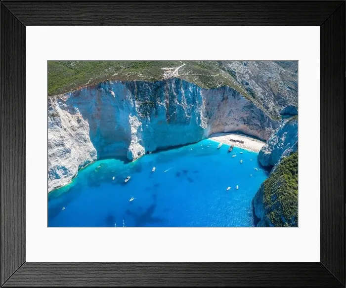 Framed Print : Aerial drone shot of Zakynthos Navagio beach with observation deck on cliff and yachts in summer Framed Print : Aerial drone shot of Zakynthos Navagio beach with observation deck on cliff and yachts in summer