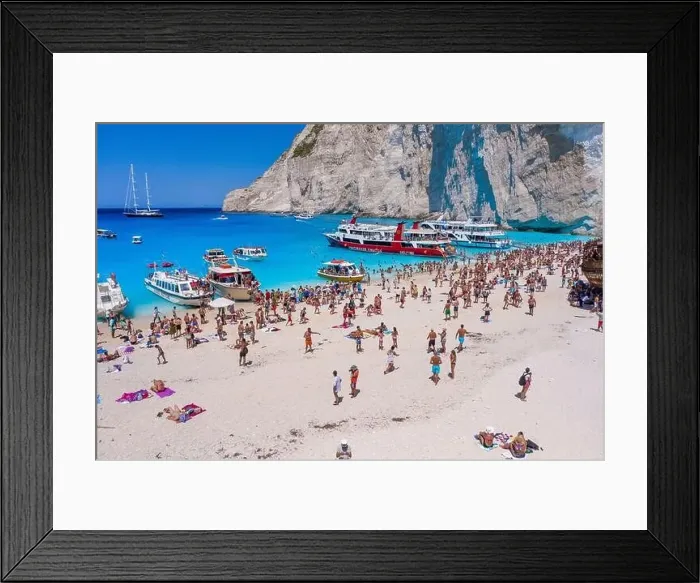 Framed Print : Zakynthos, Greece - August 20, 2019: Aerial drone shot of tourists on Zakynthos Shipwreck Navagio beach Framed Print : Zakynthos, Greece - August 20, 2019: Aerial drone shot of tourists on Zakynthos Shipwreck Navagio beach