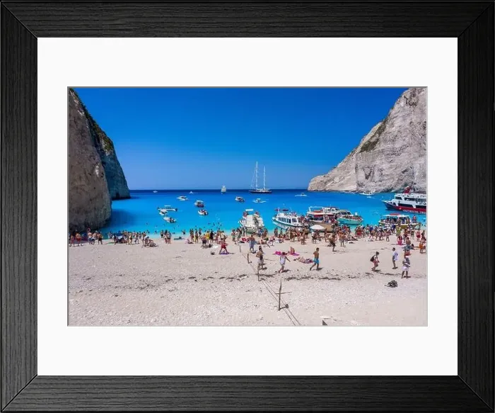 Framed Print : Zakynthos, Greece - August 20, 2019: Aerial drone shot of tourists on Zakynthos Shipwreck Navagio beach Framed Print : Zakynthos, Greece - August 20, 2019: Aerial drone shot of tourists on Zakynthos Shipwreck Navagio beach