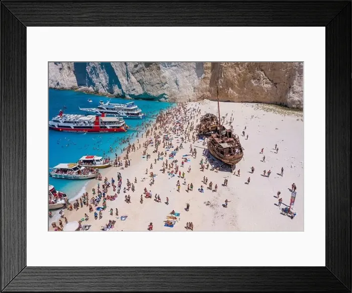 Framed Print : Zakynthos, Greece - August 20, 2019: Tourists enjoy summer time by abandoned rusty ship on shipwreck navagio beach Framed Print : Zakynthos, Greece - August 20, 2019: Tourists enjoy summer time by abandoned rusty ship on shipwreck navagio beach