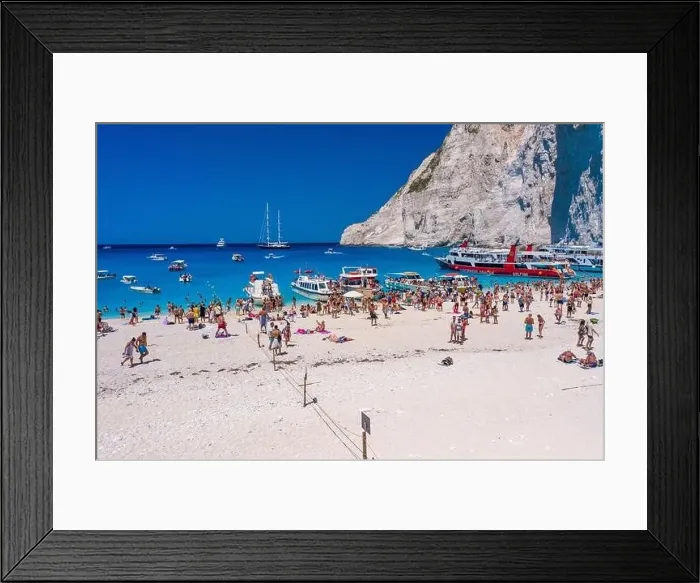 Framed Print : Zakynthos, Greece - August 20, 2019: Aerial drone shot of tourists on Zakynthos Shipwreck Navagio beach Framed Print : Zakynthos, Greece - August 20, 2019: Aerial drone shot of tourists on Zakynthos Shipwreck Navagio beach
