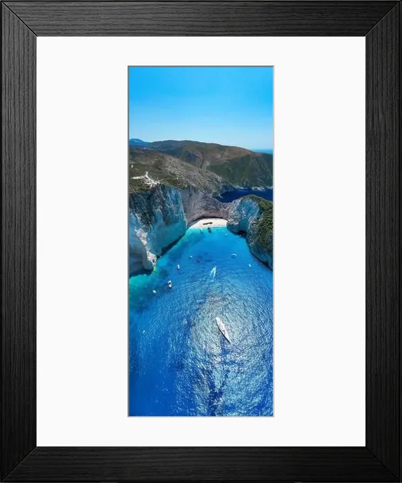 Framed Print : Portrait aerial drone shot of Zakynthos Navagio beach with yachts and cruise ship in Ionian sea in Greece Framed Print : Portrait aerial drone shot of Zakynthos Navagio beach with yachts and cruise ship in Ionian sea in Greece