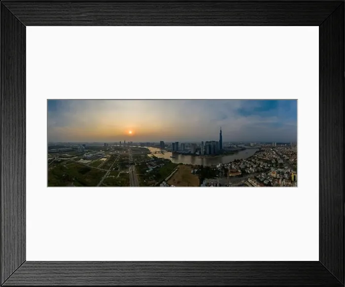 Framed Print : Smoggy Sunset Panorama over Saigon River in Ho Chi Minh City, Vietnam featuring the City Skyline
