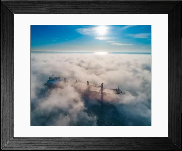 Framed Print : Cargo ship and cranes silhouettes in sea fog, crane vessel working for delivery of delivery containers