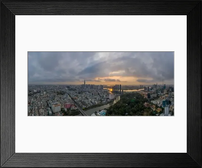 Framed Print : Sunrise panorama of Ho Chi Minh City and Saigon River including all key buildings with beautiful sky Framed Print : Sunrise panorama of Ho Chi Minh City and Saigon River including all key buildings with beautiful sky