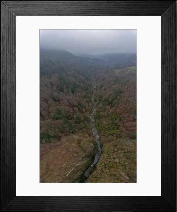 Framed Print : op down drone view of a river gorge flowing through a misty forest alpine landscape on a foggy winters day Framed Print : op down drone view of a river gorge flowing through a misty forest alpine landscape on a foggy winters day