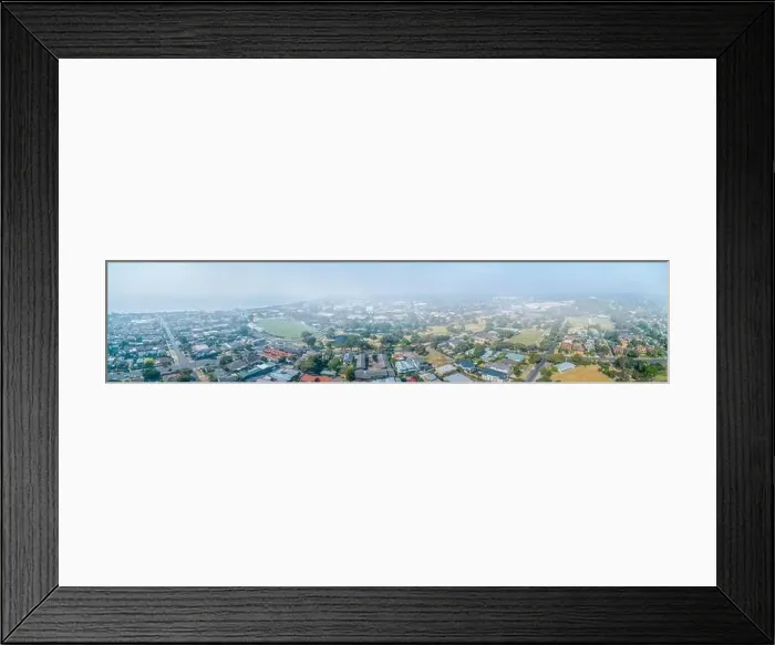 Framed Print : Wide aerial panorama of suburbs covered in smoke haze from bush fires in Gippsland, Victoria, Australia Framed Print : Wide aerial panorama of suburbs covered in smoke haze from bush fires in Gippsland, Victoria, Australia